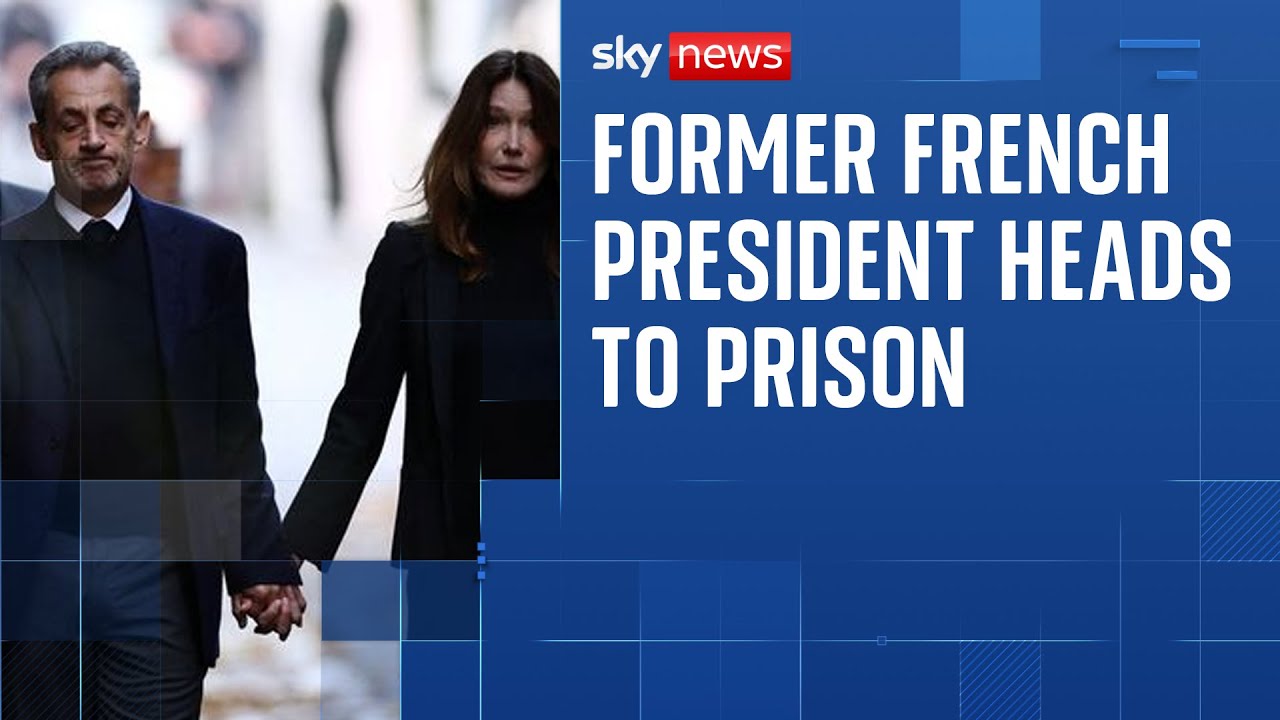Nicolas Sarkozy walks with Carla Bruni on way to begin his five-year prison term
