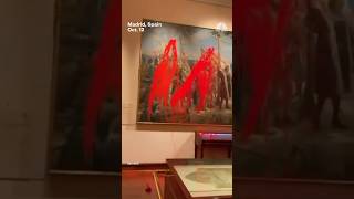 Climate activists vandalize Christopher Columbus painting on Spain's National Day