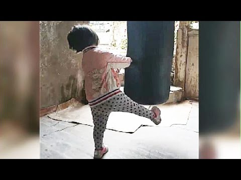 Cute and Funny Toddler Girl  Trying Boxing Bag For The First Time