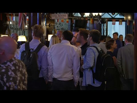 Londoners watch general election exit poll at the pub | AFP