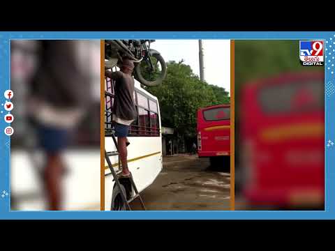 Man climbs Bus ladder with Motorbike on his head, Internet calls him "Superman and Baahubali" 