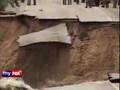 US: Floods - Home washed into Lake Delton