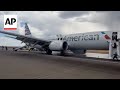 Passengers flee smoking jet after apparent landing gear problem at Denver airport