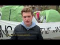 Israel supporter stands near pro-Palestinian encampment at University of Michigan  - 00:41 min - News - Video