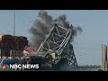 Section of Baltimore bridge brought down in controlled explosion