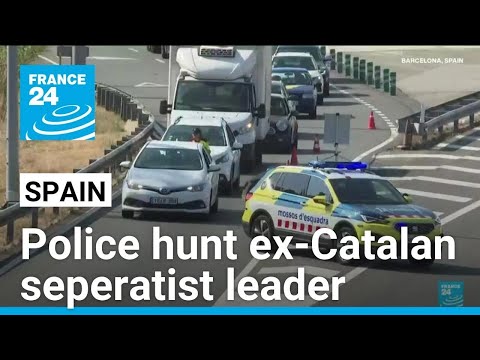 Police hunt ex-Catalan seperatist leader Puigdemont, who fled shortly after returning to Spain