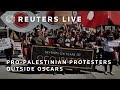 LIVE: Pro-Palestinian protesters gather outside Oscars | REUTERS