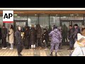 Russians form long queues to protest Putin at presidential election