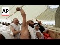 Muslim pilgrims cast first stones at pillar of Satan during Hajj