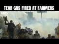 Farmers Protest 2024 | Tear Gas Fired At Farmers Marching Towards Delhi At Punjab-Haryana Border