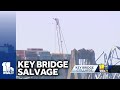 Cranes removing wreckage of Key Bridge; 4 unaccounted for
