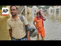 New Delhi family seeks relief from some of the worst floods to hit northern India in decades