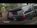 California rain: Cars buried in mudslide, dramatic river rescue caught on camera  - 01:40 min - News - Video