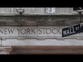 Wall Street indexes end lower as investors digest Powell comments | REUTERS