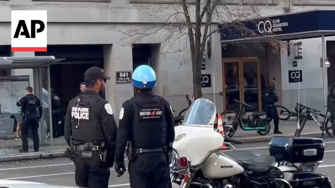 Two National Guard members shot near White House treated on the sidewalk