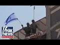 IDF seen raising Israeli flag inside Gaza