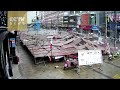 Shocking moment: Two men trapped as scaffolding collapses