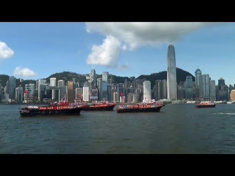 Boats parade in Hong Kong harbour ahead of 25th handover anniversary | AFP