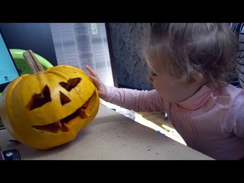Cute Baby Meeting to Halloween Pumpkin for the first time