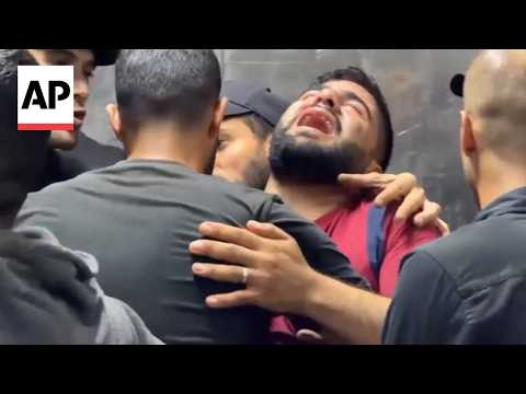 Relatives mourn loved ones after Israeli strike hits vehicle in Gaza, killing 2