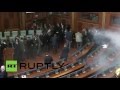 Teargas released in Kosovo's parliament by opposition lawmakers - Visuals