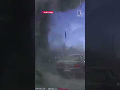 Moment Israeli airstrike hits next to busy road in Iran