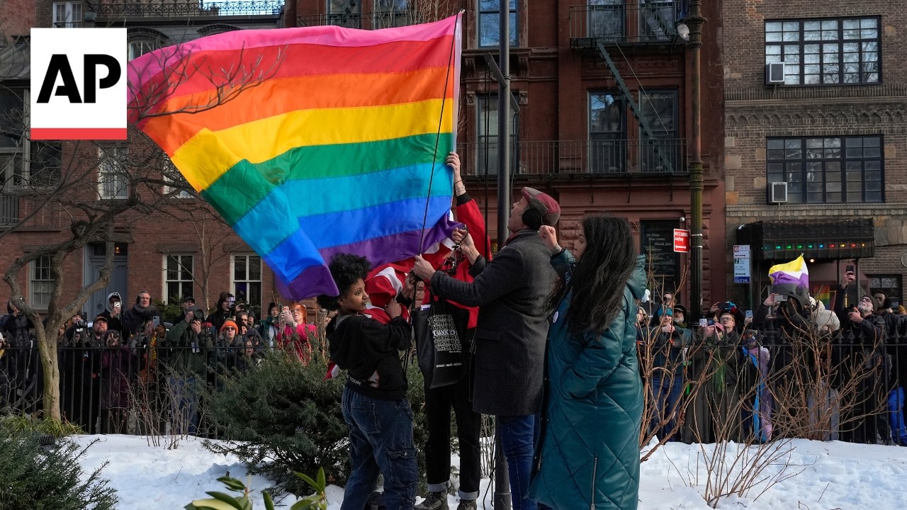 New York officials raise a rainbow flag at Stonewall National Monument