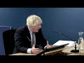 Former UK Prime Minister Boris Johnson apologizes for COVID deaths, protester interrupts