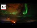 Lava and northern lights: Eruptions slowing from volcano in Iceland