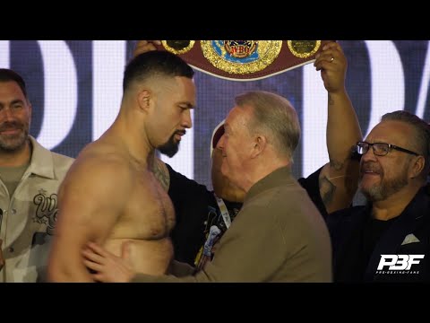 FRANK WARREN FACES OFF AND PUSHES JOSEPH PARKER AT WEIGH IN AS NO SIGN OF MARTIN BAKOLE