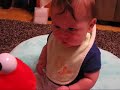 Matthew baby plays with Tickle Me Elmo