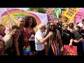 Sun shines on tens of thousands of revellers joining annual Pride parade in central London  - 01:00 min - News - Video