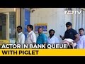Actor Ravi Babu spotted with piglet in front of bank