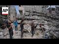 Gaza workers salvage iron bars from destroyed buildings for shelters, furniture
