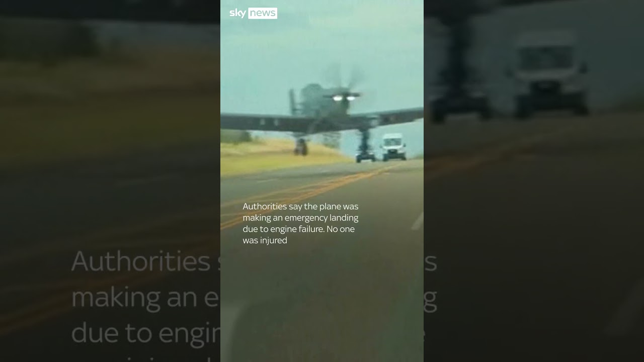 Moment US military plane nearly hits car