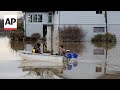 Residents clean up and assess damage after Washington state flooding