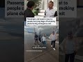 Passenger and expert react to people carrying bags off smoking plane during emergency exit  - 01:07 min - News - Video