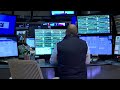 Wall Street indexes post record-high closes; Tesla and Micron rally | REUTERS