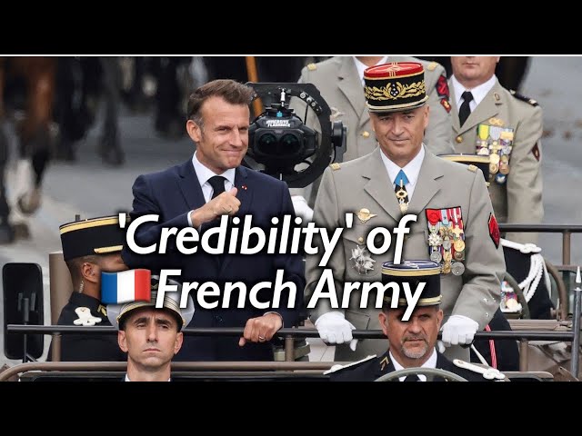 SCENE: French troops parade down Champs Elysee on Bastille Day as Macrons looking on