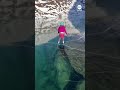 Skaters glide over translucent ice window lake in Alaska - ABC News