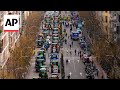 Hundreds of tractors advance on Madrid as farmers protest EU policies
