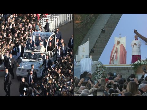 Pope Francis greets the crowd before celebrating mass in Ajaccio | AFP