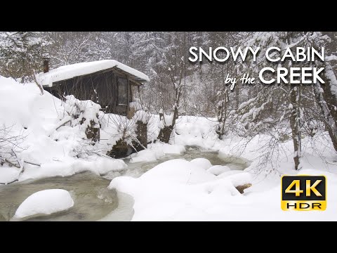 4K HDR Snowy Cabin by the Creek - Snow Blizzard & Stream Sounds - Cozy Forest Hut & Winter Ambiance