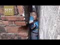Boy gets stuck between narrow walls,saved -Exclusive