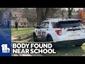Police: Womans body found near Baltimore school