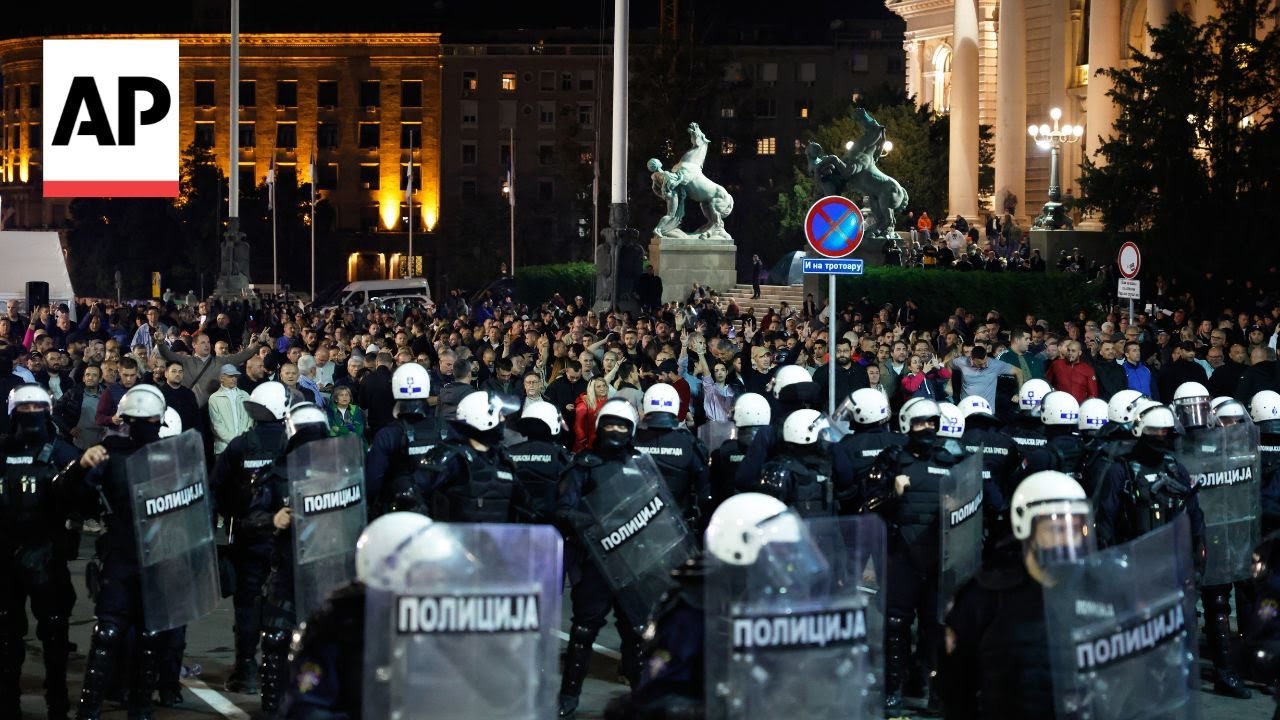 Riot police separate opponents, loyalists of Serbia's president as tensions soar amid protests