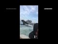 Video shows French police circling migrants trying to cross English Channel  - 00:50 min - News - Video