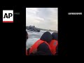 Video shows French police circling migrants trying to cross English Channel