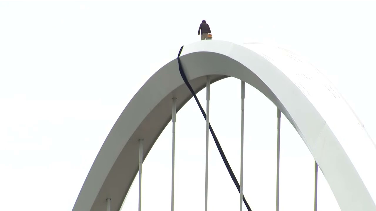 Protester emerges from tent on Frederick Douglass Memorial Bridge for 2nd day of protest