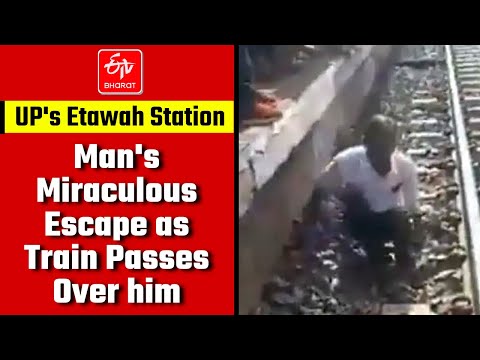 Man miraculously escapes as train passes over him, viral video